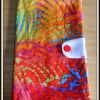 Protège chéquier tissu batik tons orangés